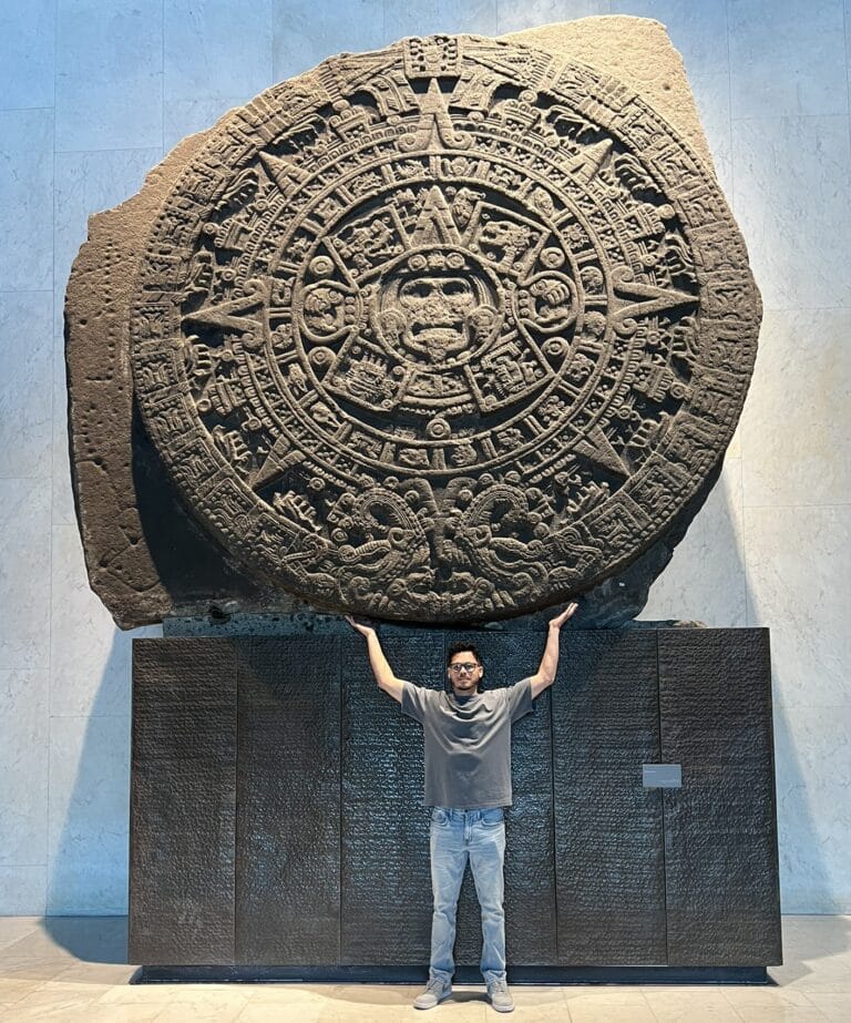 Me holding up a circular Mayan Calandar at the National Museum of Anthropology in Mexico City