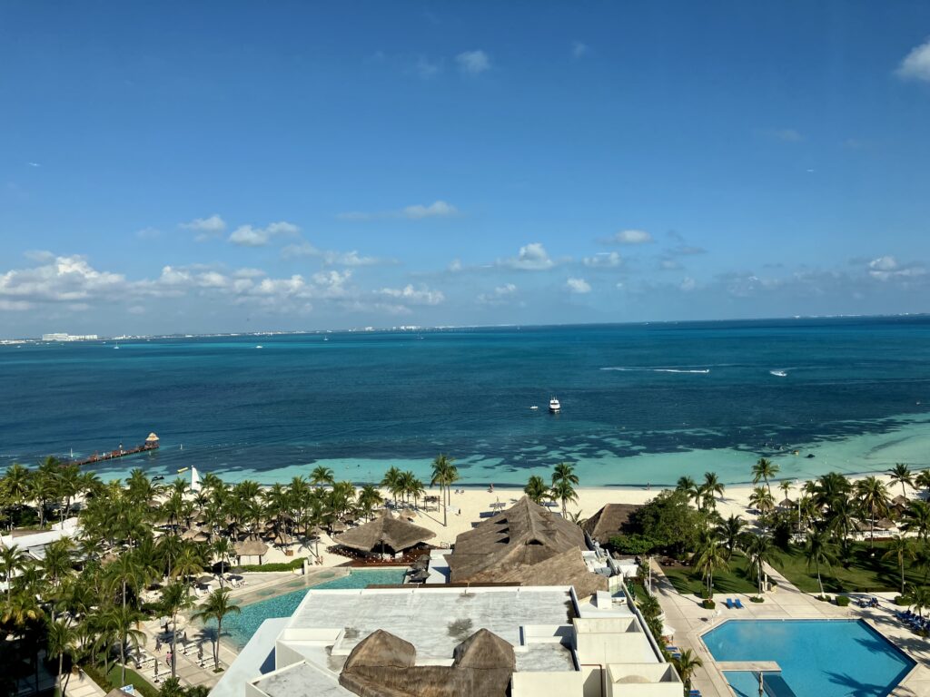 A view of the blue waters of the north facing beach outside of the Intercontinental Hotel in Cancún, Mexico