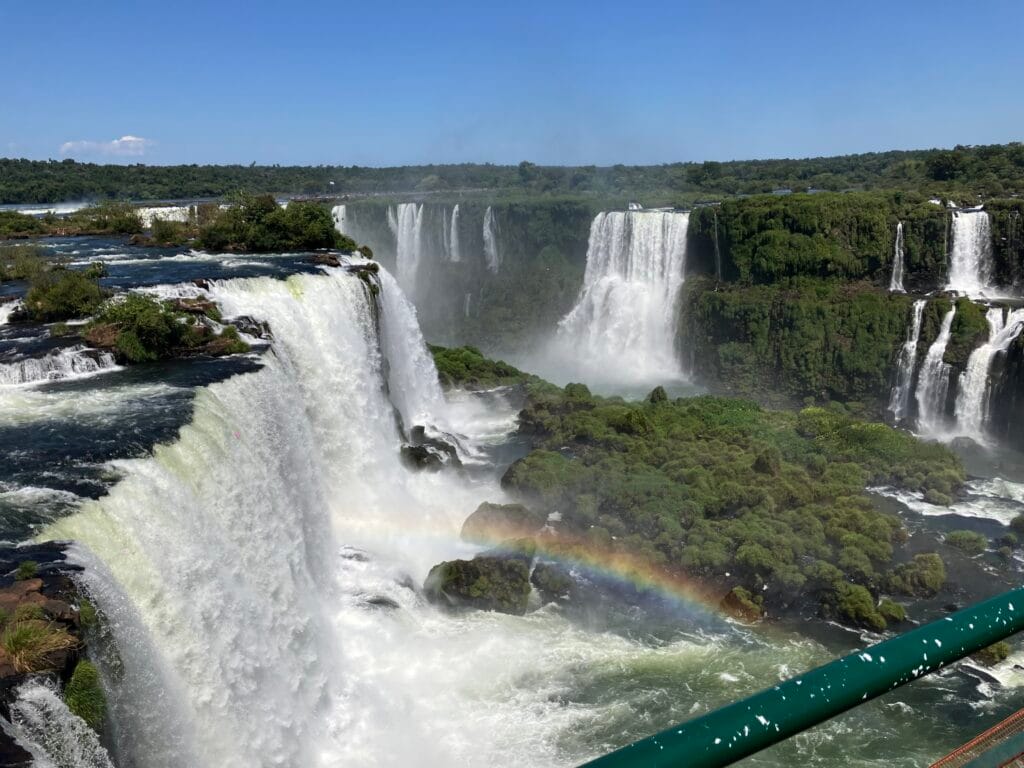 A wide view of the Devil's Throat chasm waterfall and surround waterfalls at Iguazu Falls in Brazil