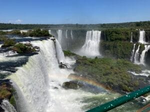A wide view of the Devil's Throat chasm waterfall and surround waterfalls at Iguazu Falls in Brazil