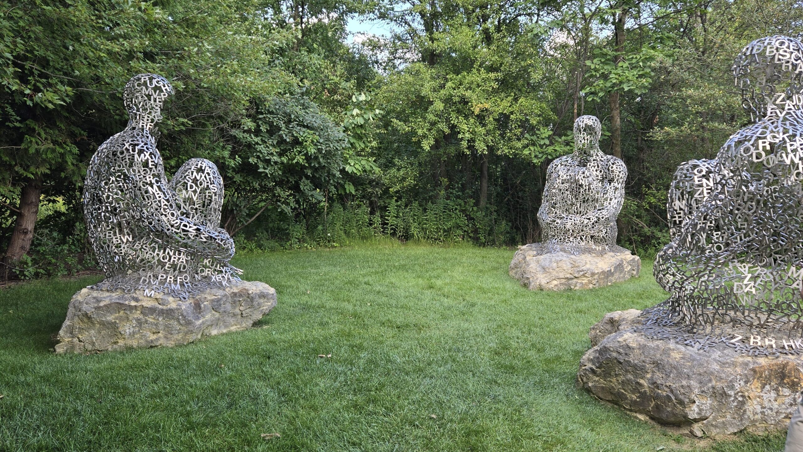 Three metal sculptures outside in Meijer Gardens & Sculpture Park