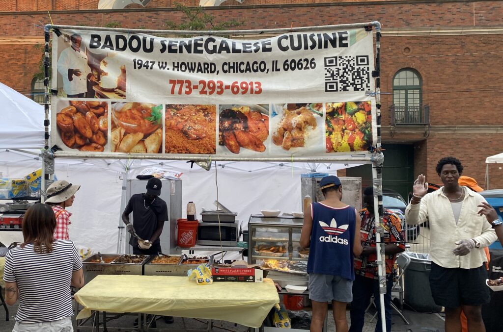 A vendor of Senegalese Cuisine at a neighborhood street festival in Chicago