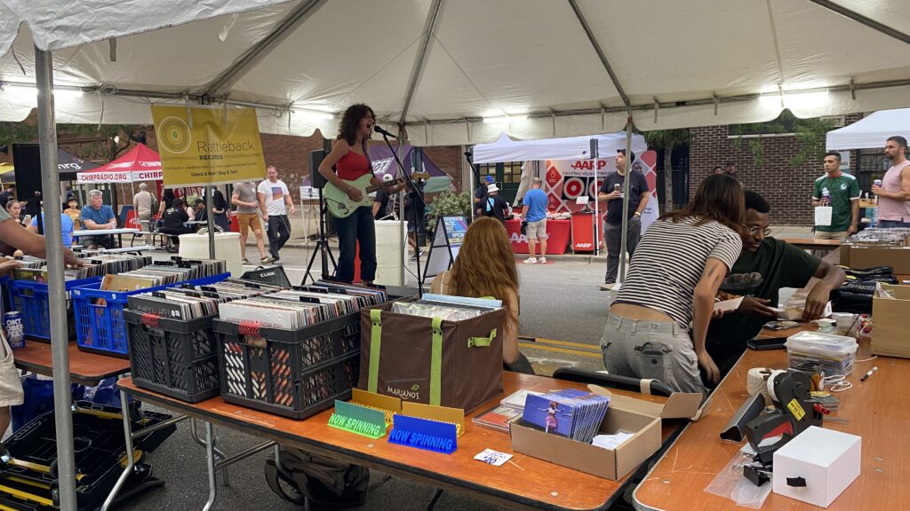 A musican performing solo at a street festival in Chicago