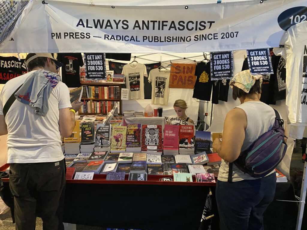A vendor selling books at a summer festival in Chicago
