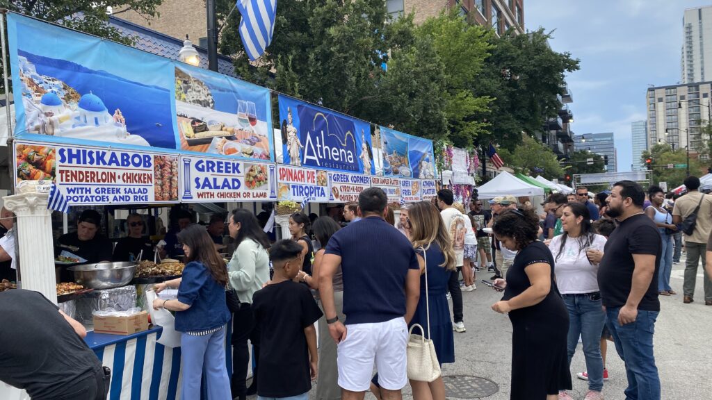 People waiting in line for food at a greek food festival in Chicago
