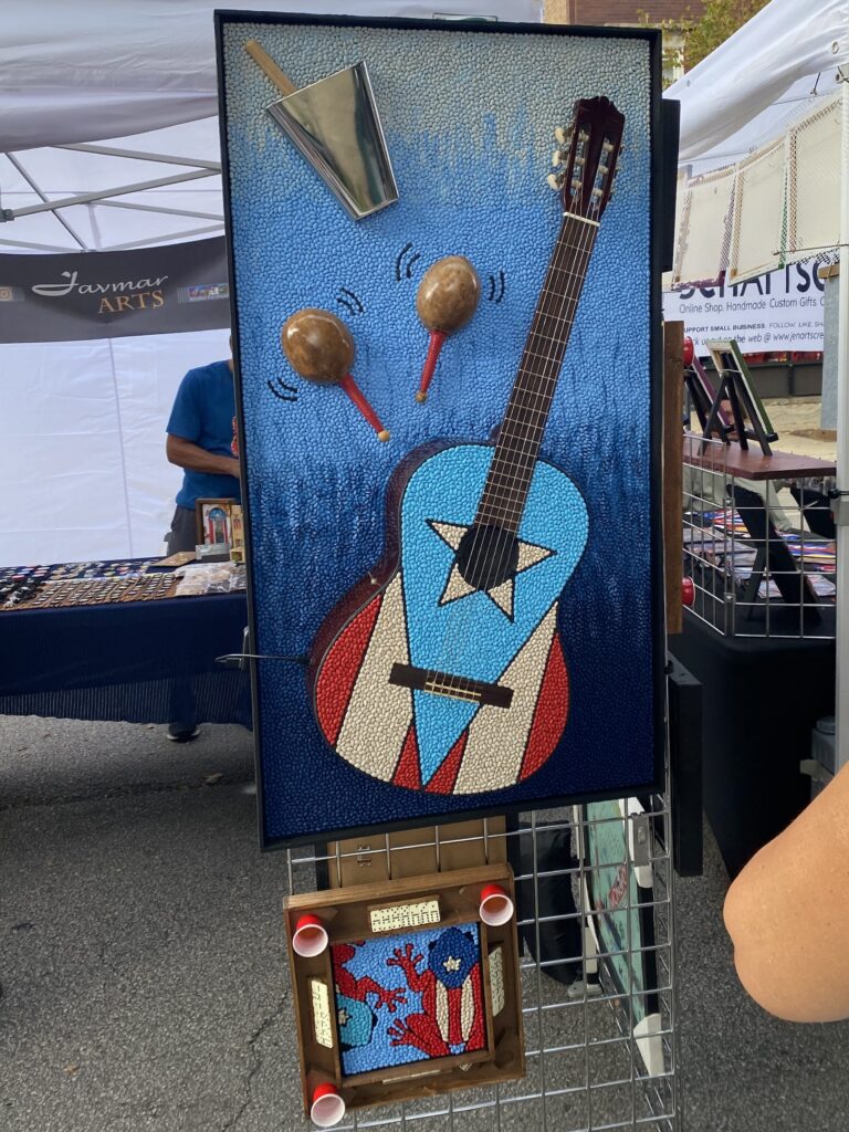 A guitar designed with a Puerto Rican flag at the Puerto Rican festival in Chicago