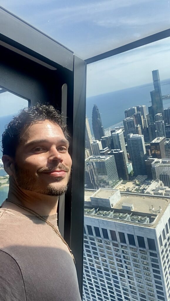 Me standing at TILT, overlooking the Chicago skyline at 360 Chicago