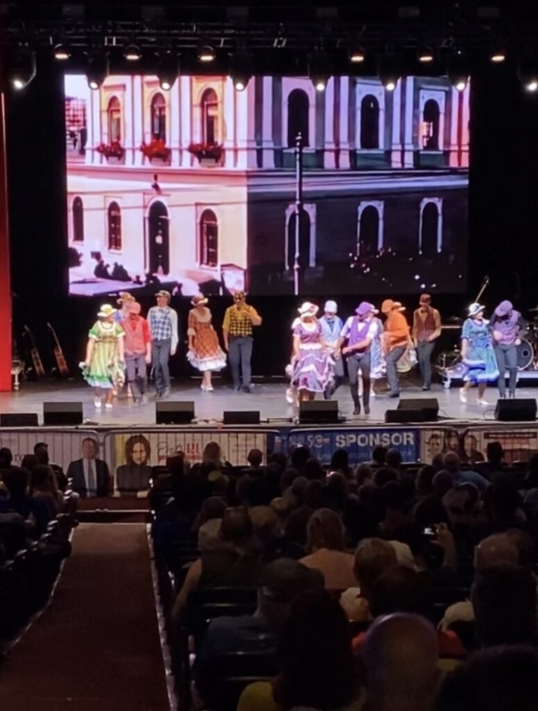 A group of dancers performing at a theatre for the taste of Polonia in Chicago