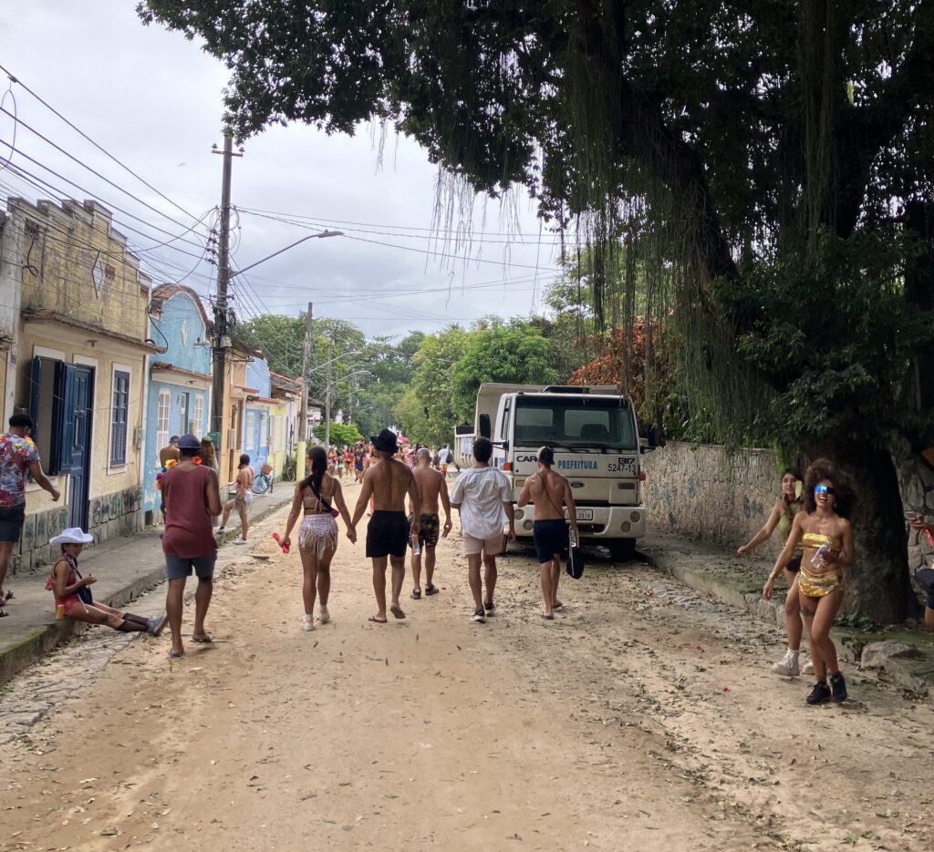 Party goers walking in the street on Paqueta Island for Carnival in Rio de Janeiro